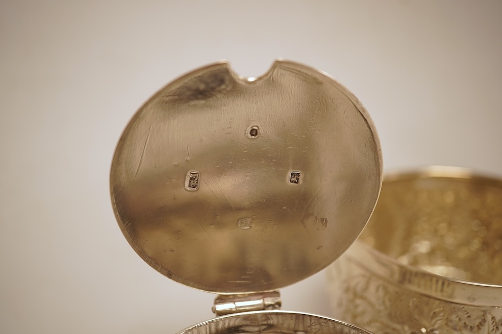 A George III silver helmet shaped cream jug, marks rubbed, 10cm(a.f.), together with a later Victorian silver sugar bowl and similar pierced silver mustard pot, no liner.